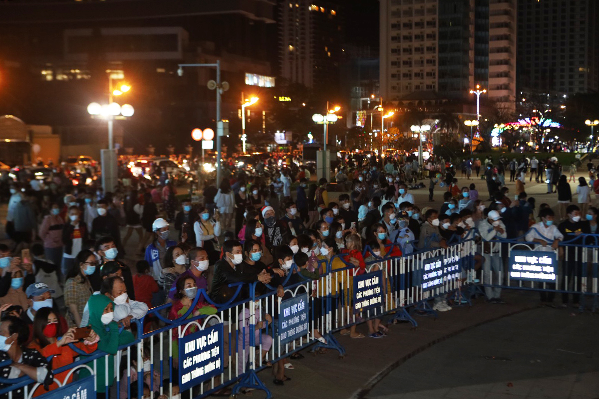 People of Nha Trang watch performances to celebrate the New Year from afar.