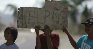 'A little aid would help': Philippine typhoon survivors beg for food