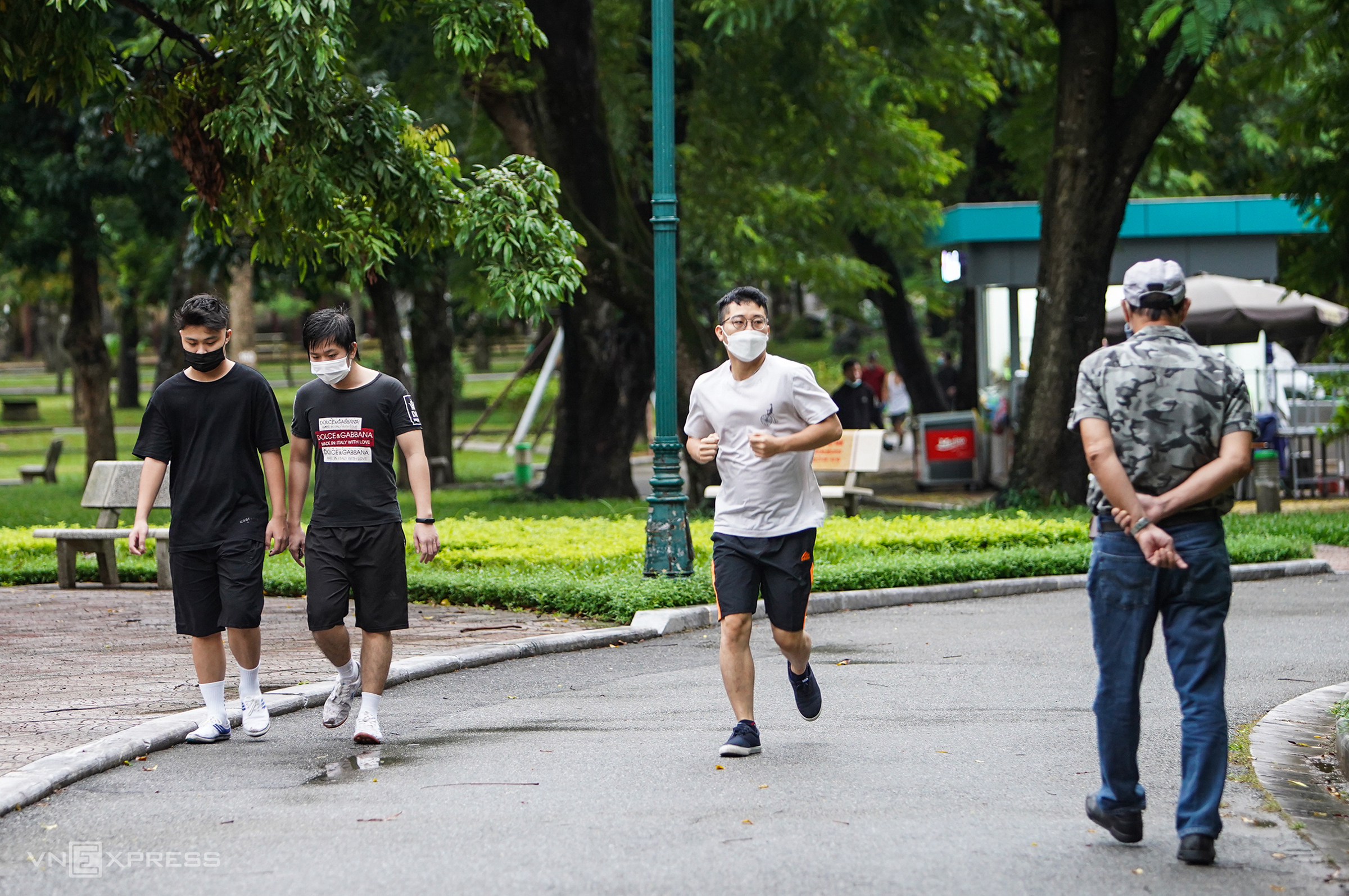 People walk and jog in a park in Hanoi, October 14, 2021. Photo by VnExpress/Giang Huy