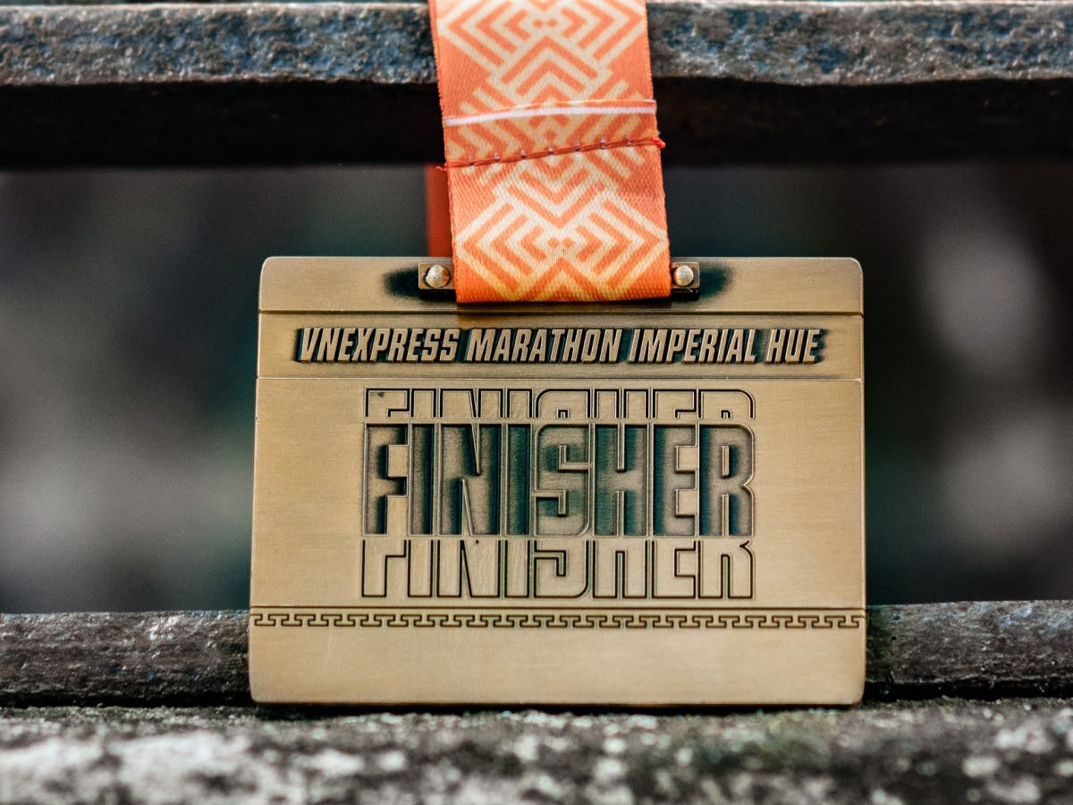 The back of the medal is marked with the race name VnExpress Marathon Imperial Hue and the word Finisher.