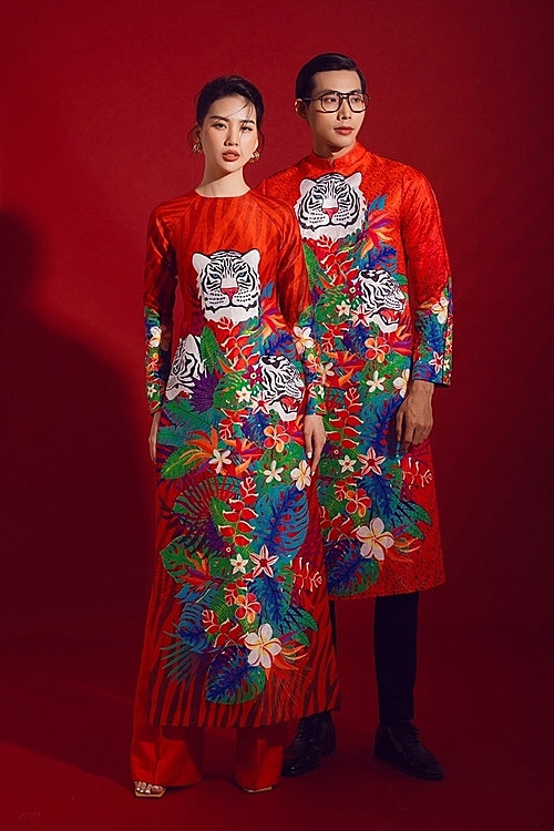 Adrian Anh Tuan dropped a stylized ao dai collection featuring this years zodiac sign on the dominant red color. Photo by Linh Pham