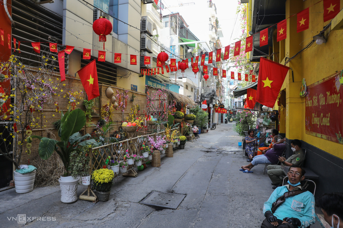 An alley in HCMC is adorned with colorful Tet decorations in January 2022. Photo by VnExpress/Quynh Tran