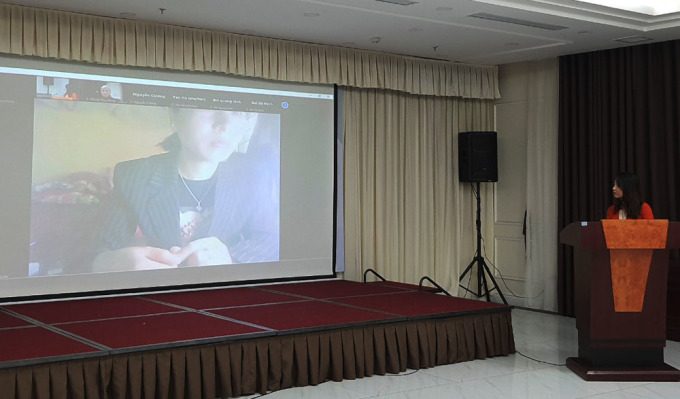 Nguyen Thi Tinh shares her past story working in Thailand via Zoom during the book launching event on Feb. 28, 2022. Photo by VnExpress/Pham Nga