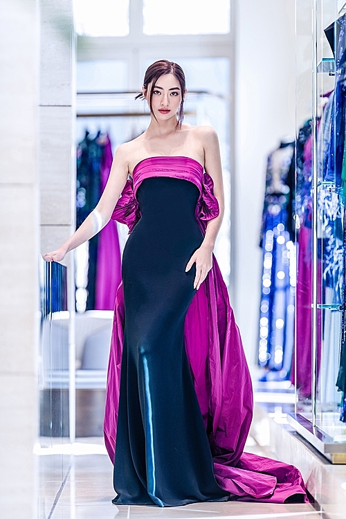 Saab incorporated embroidery, threading, and hand-sewing techniques in his designs.  He also used bold colors such as royal purple and azalea pink to help its wearers stand out in the crowd. Linh wore a tight dress that helps accentuate her body figure.