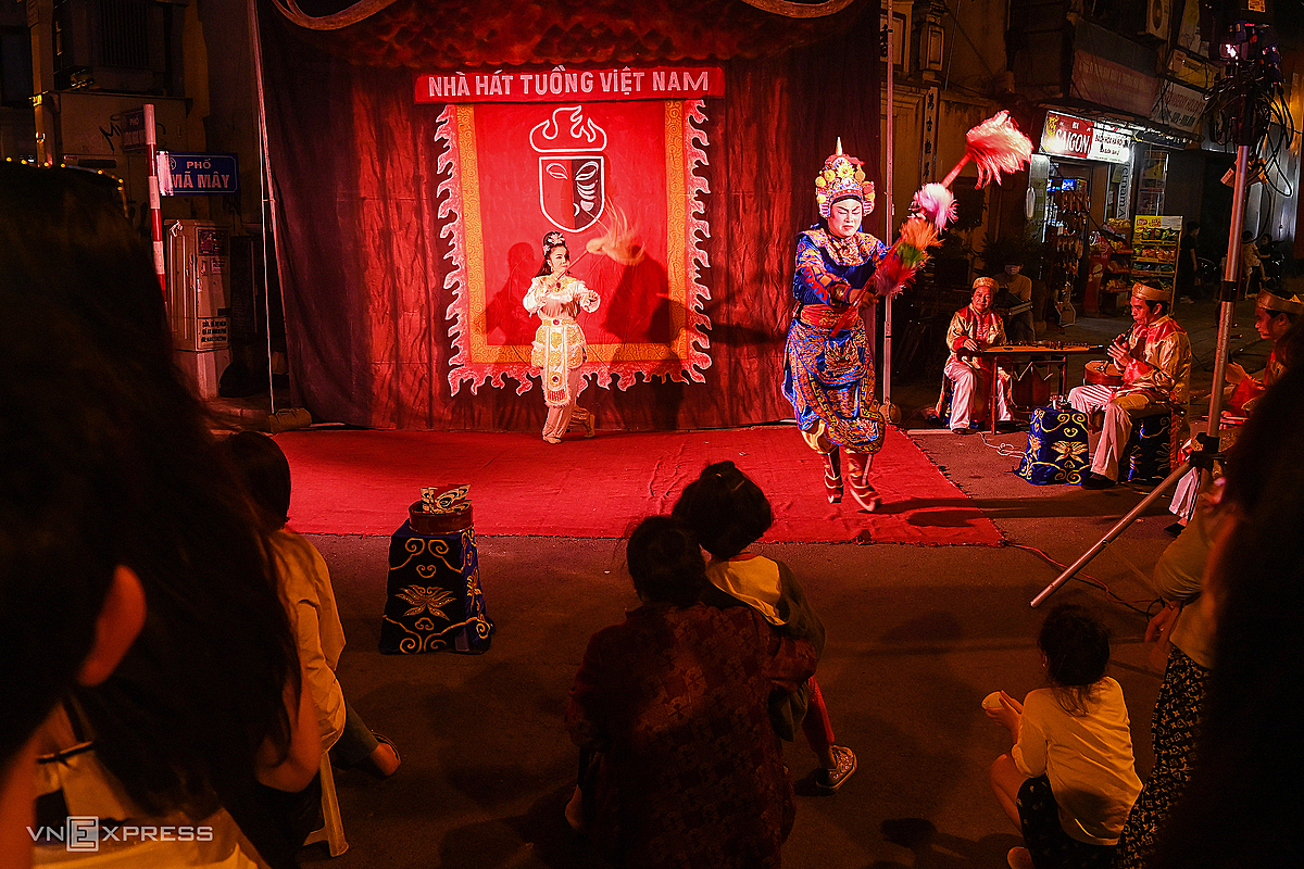 A group of artists perform an ancient play on Ma May Street.