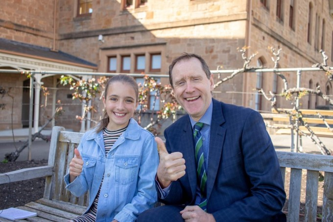 Dr. John Newton, gross principal of Scotch College Adelaide, poses for a photo with a student. Photo by Scotch College Adelaide