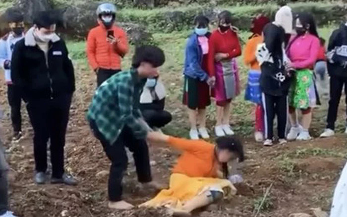 A still image from a video shared on social media shows an 18-year-old man trying to make a 16-year-old girl his wife in Ha Giang Province, February 2022.