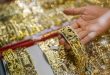 Gold prices plunge from historic peak
