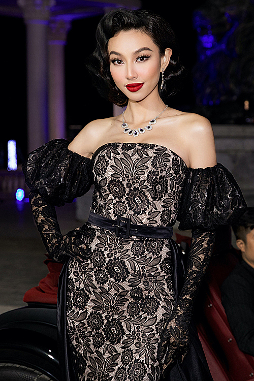 2. Model Thuy Tien dons outfits inspired by the 30s fashion with a lace off-the-shoulder dress and gloves. Photo courtesy of Thuy Tien.