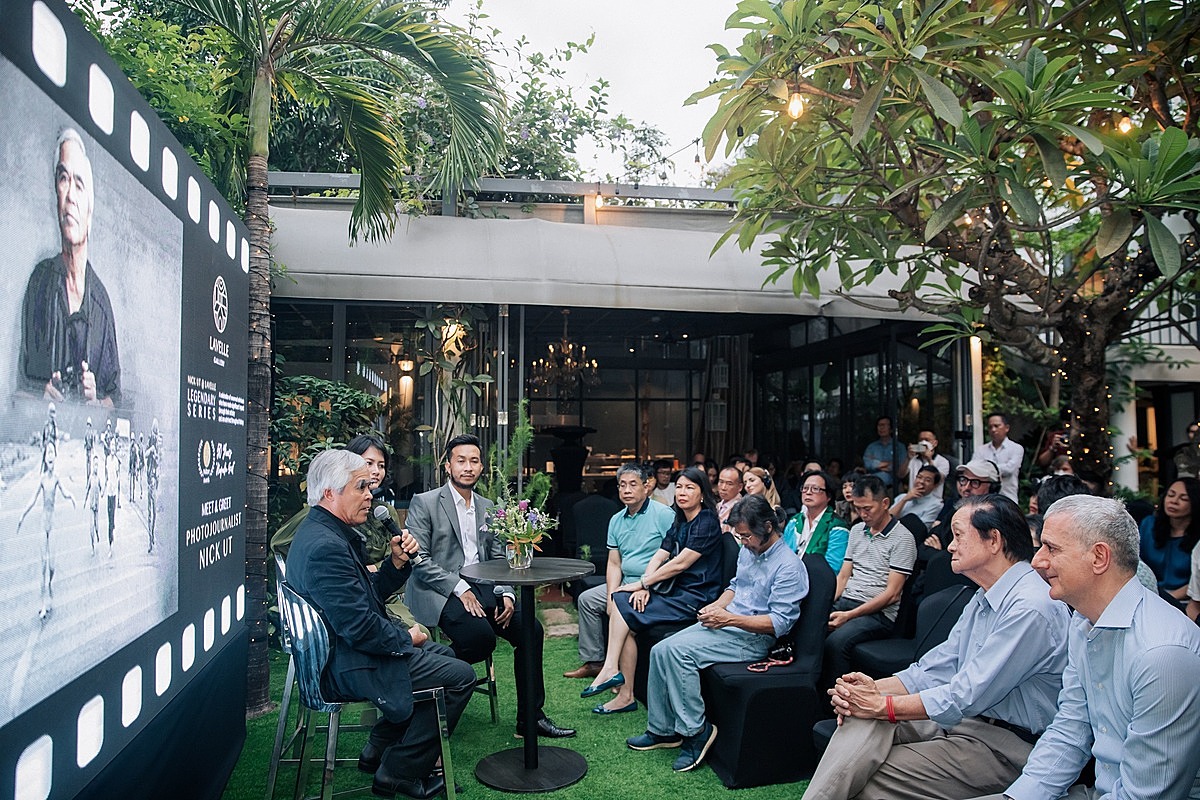 Former photojournalist Nick Ut delivers a speech at the launching of the exhibition in HCMC on April 3, 2022. Photo courtesy of Lavelle