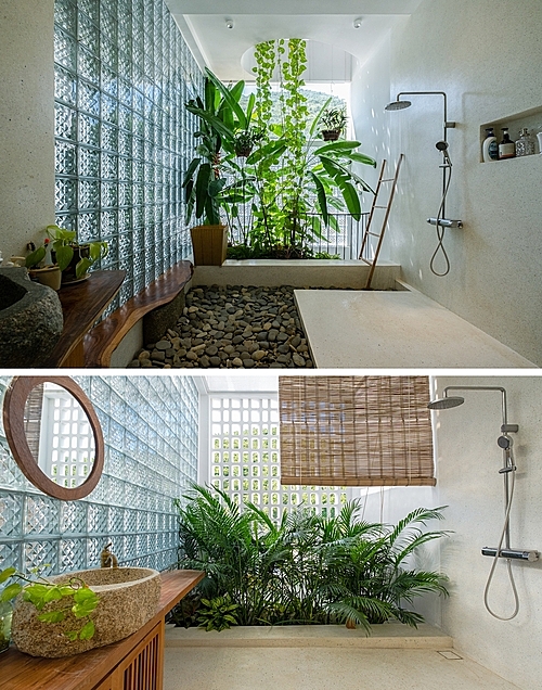 Combining with glass blocks and vegetation, the bathroom still provide occupants a place to relax without losing privacy.