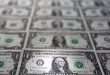 Dollar inches up to new two-year peak, set for best week in four