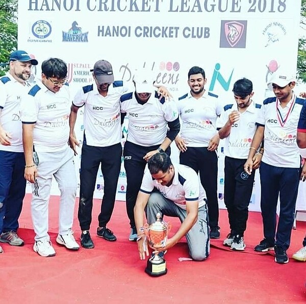 The winning team of the Hanoi Cricket League celebrate with the trophy.