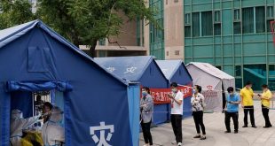 China slashes Covid quarantine time for international travelers