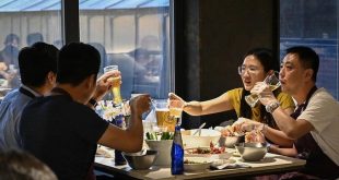 Relief, caution in Beijing as city lifts Covid dine-in curbs