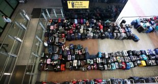 Luggage piles join long airport lines in fresh woes for summer travel