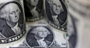 Dollar gains as investors brace for higher rates