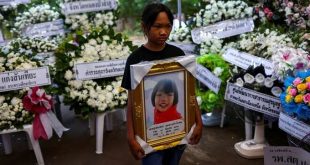 Prayers, sorrow at temples as Thailand mourns children slain in massacre