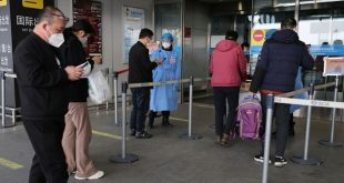 China shortens Covid quarantine times, eases flight curbs