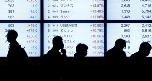 Asia shares slip, Fed flags higher rates for longer