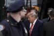 Trump arrives in New York for surrender, opposes TV court coverage