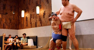 Sumo retirees play for laughs from tourists flooding back to Japan