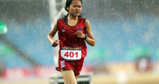 Soaked Cambodian runner gets $10,000 bonus from PM