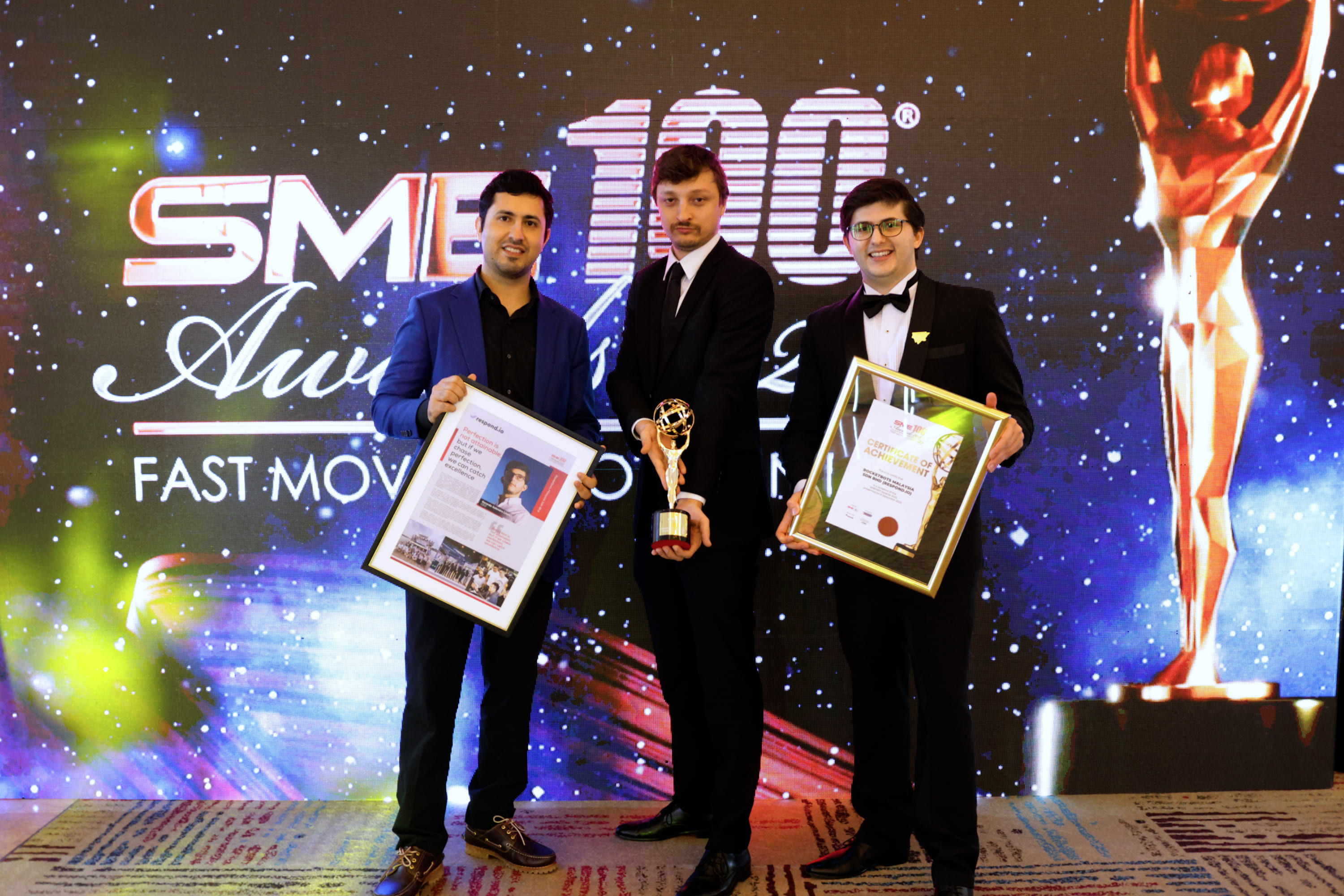 Hassan Ahmed (CTO), Iaroslav Kudritskiy (COO) and Gerardo Jose Salandra (CEO) of respond.io with their award at the SME100 2023 Awards