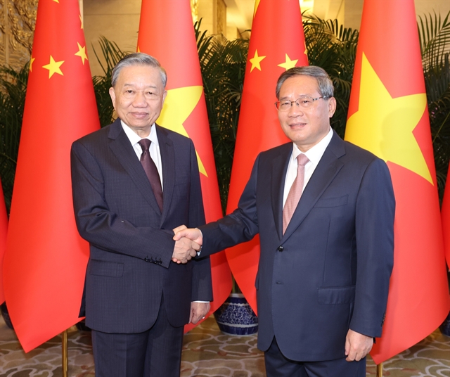 369327_4933379928672970_vna_potal_party_state_leader_meets_chinese_premier_in_beijing_7545954